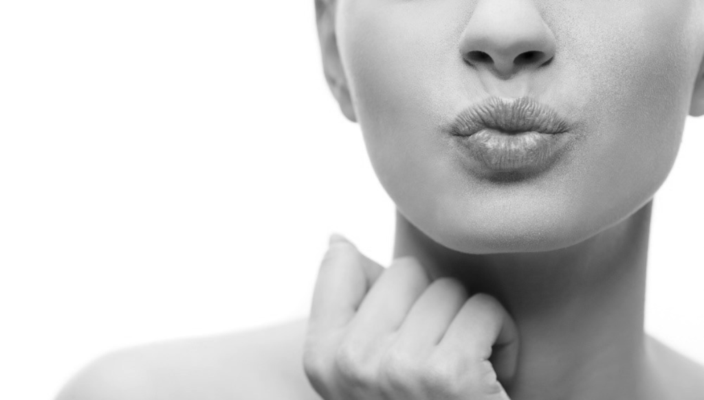 woman puckering lips for a kiss