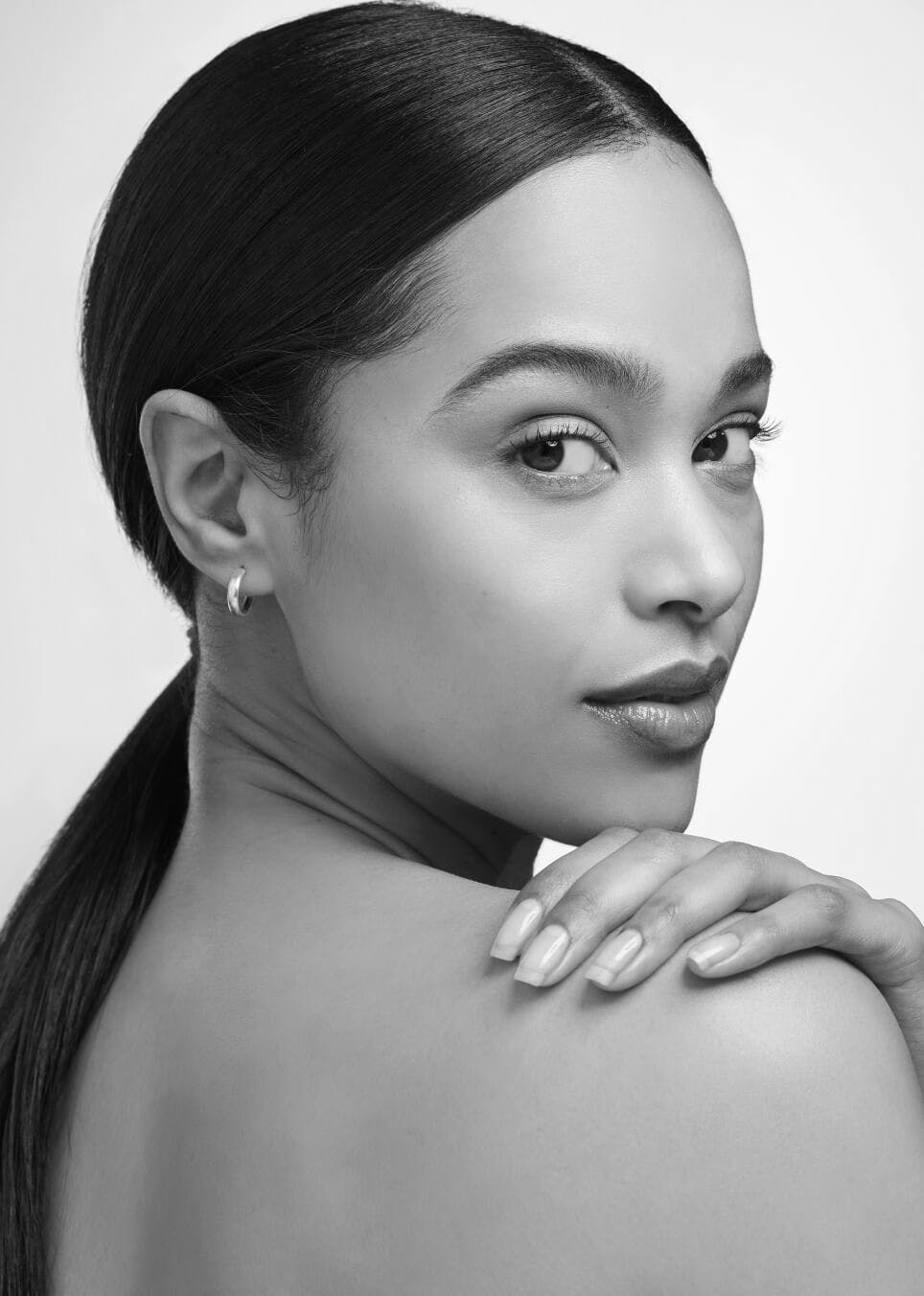 Picture of a beautiful woman looking over her shoulder