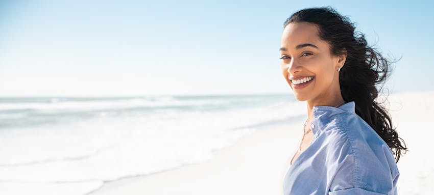 Woman smiling at the beach