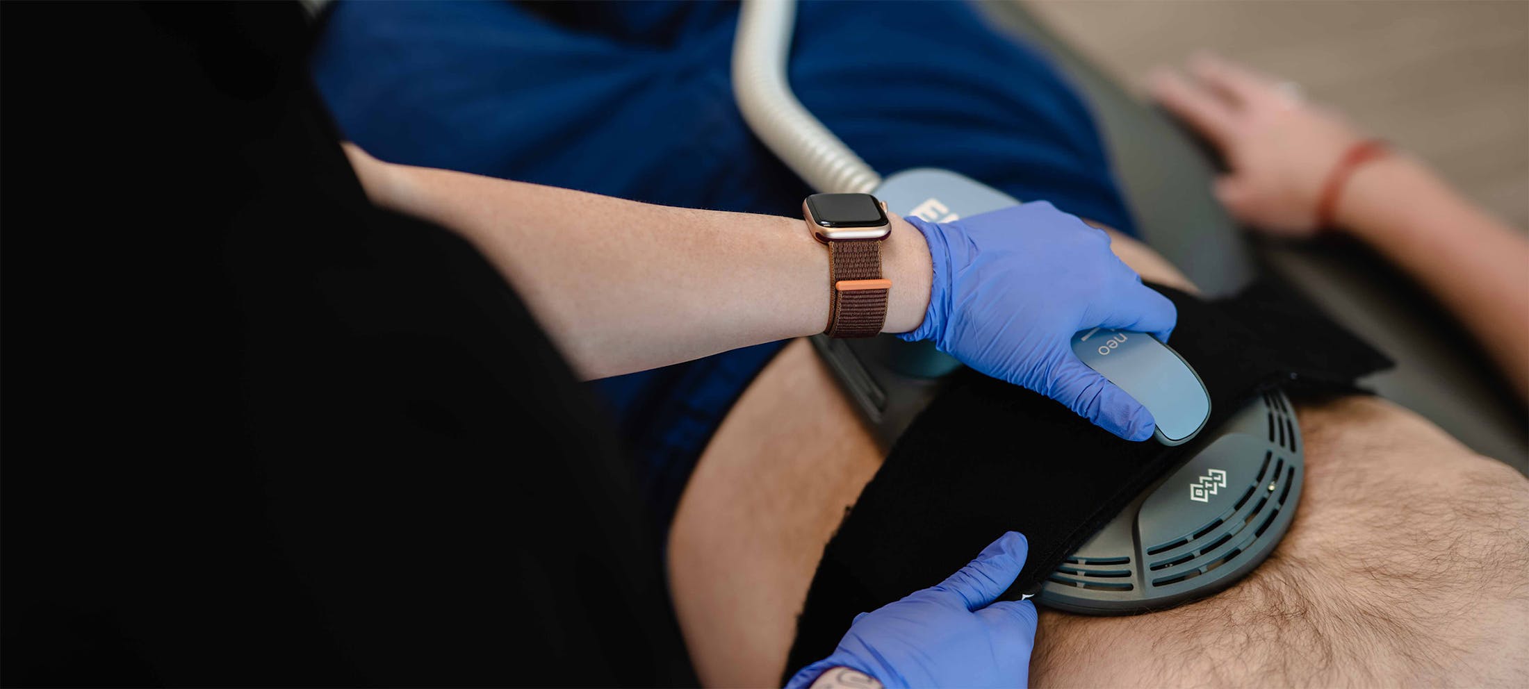 Male patient receiving Emsculpt Neo at The Piazza Center