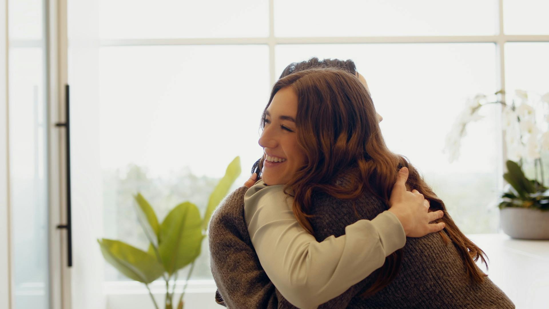 Female patient hugging her medical provider at The Piazza Center