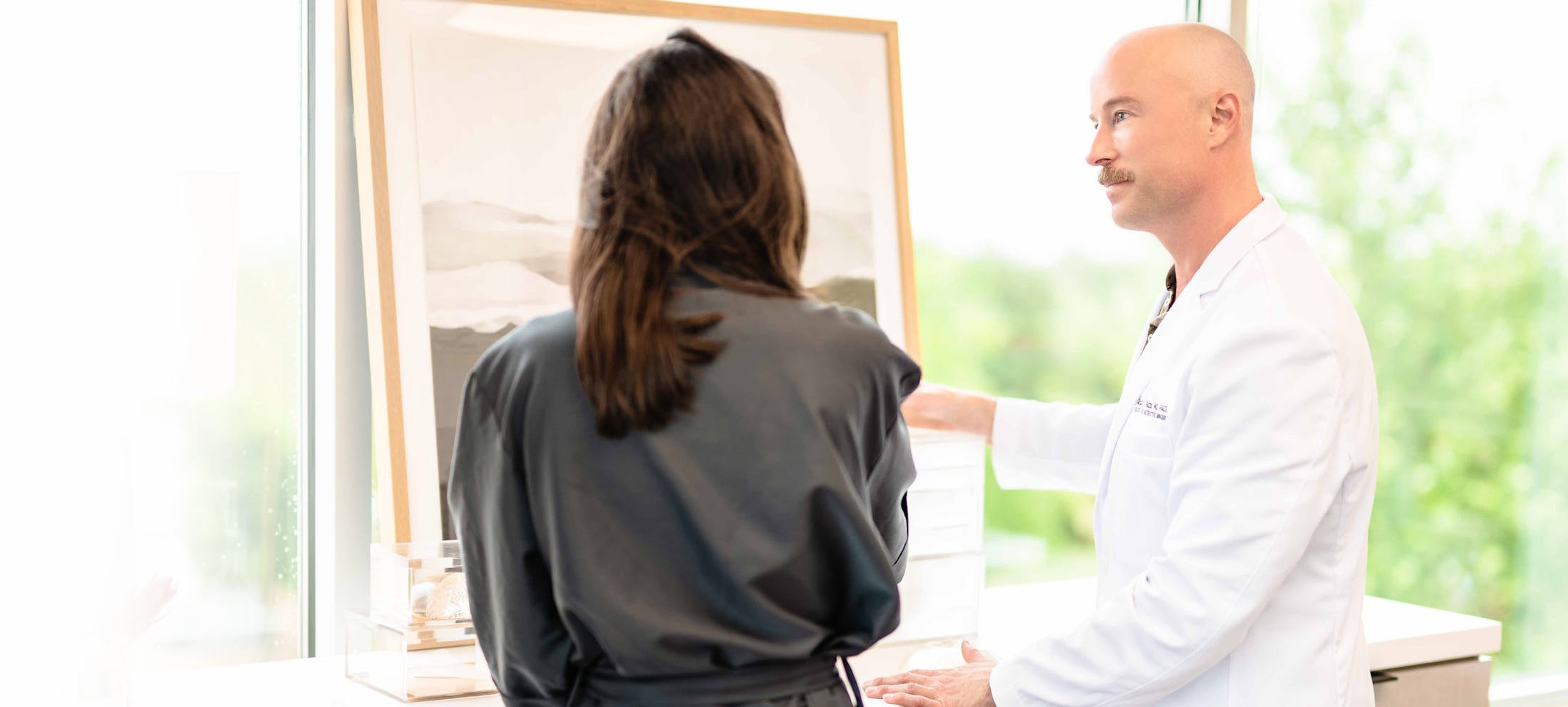 Dr. Piazza with a female patient
