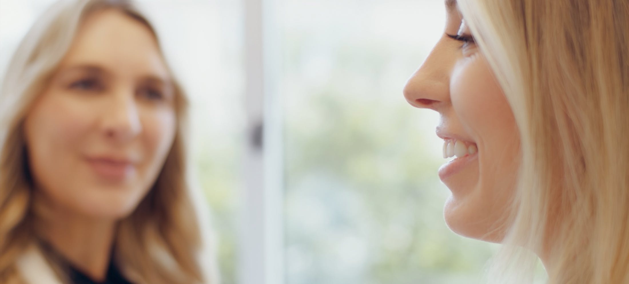 Female staff speaking with a female patient