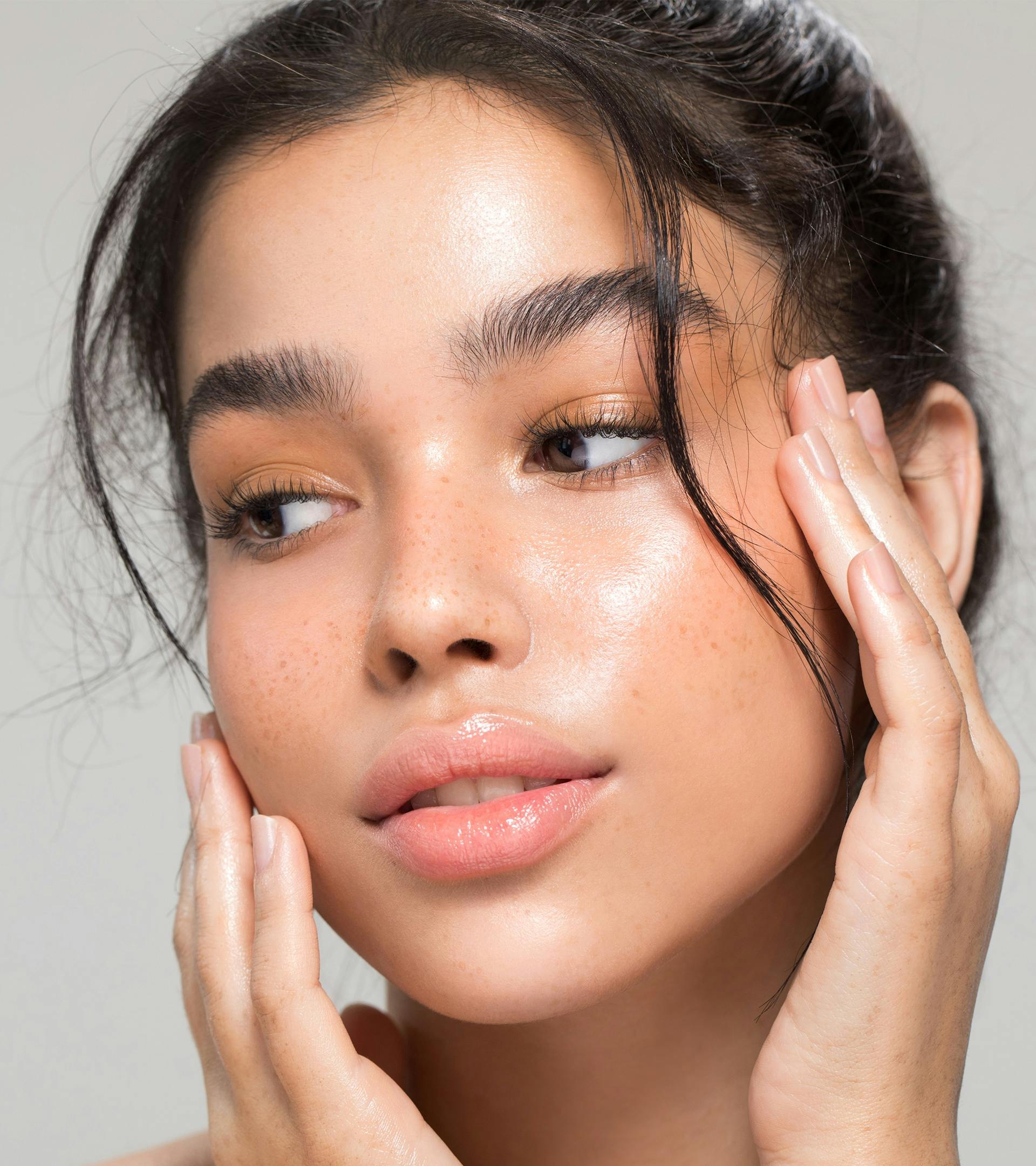 there is a woman with a hand on her face