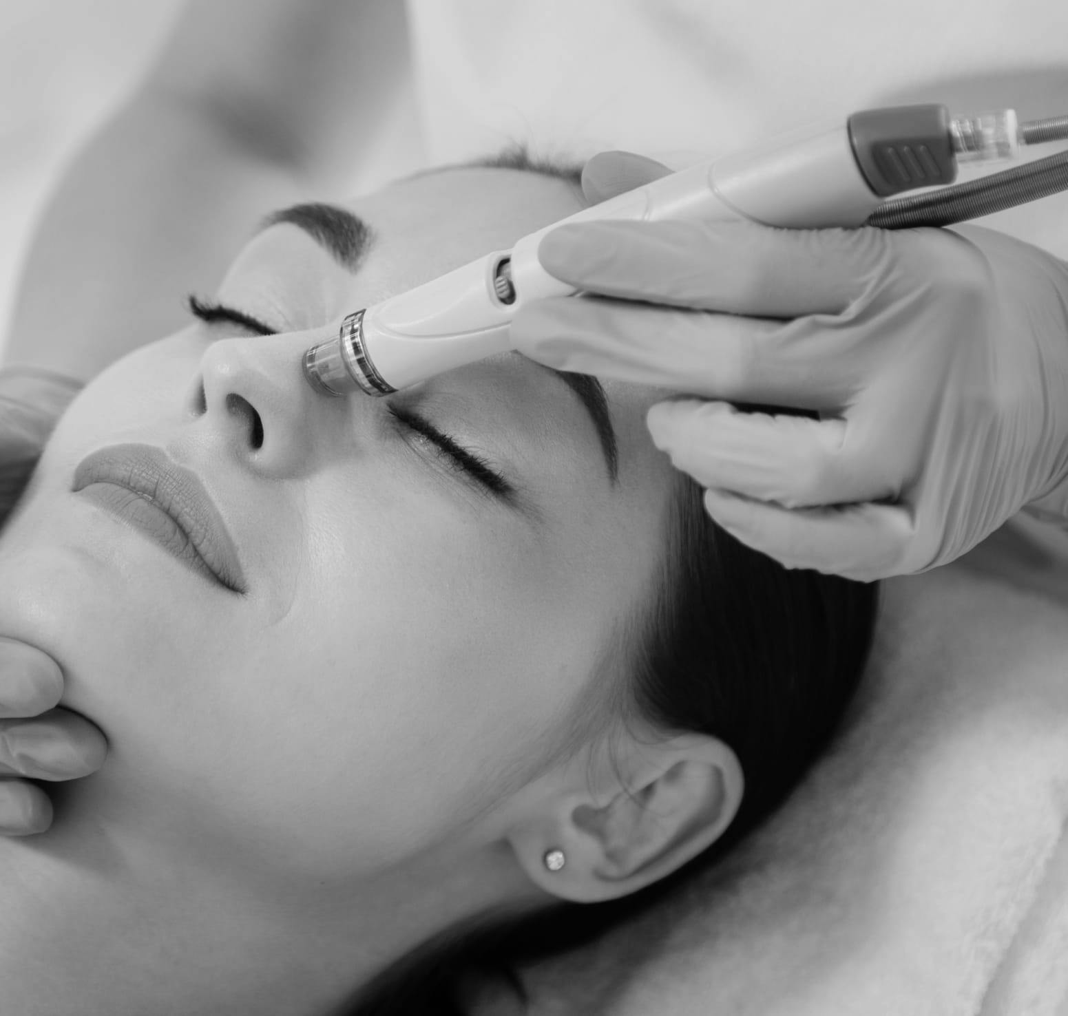 A woman getting a facial treatment