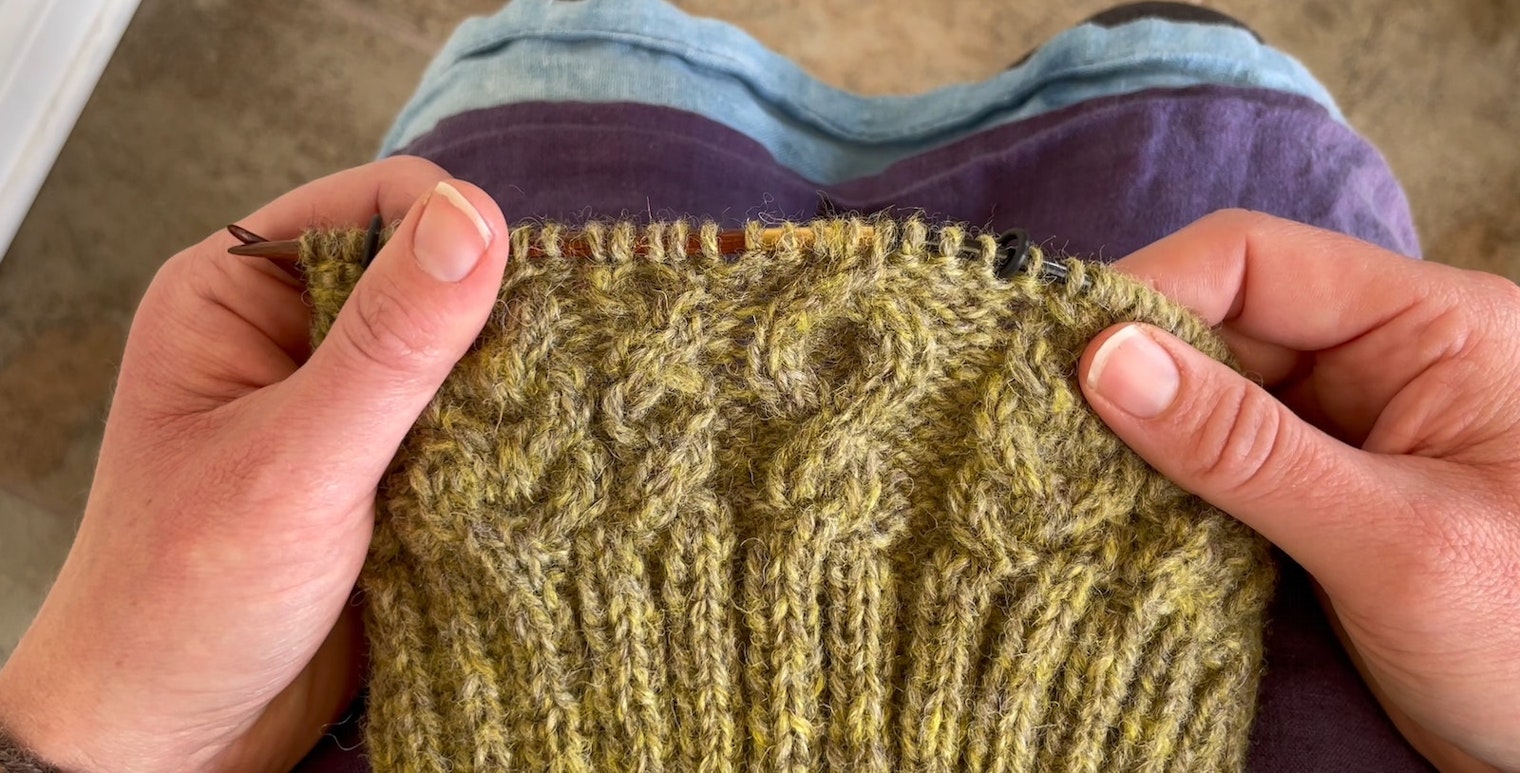 Knitting a green hat