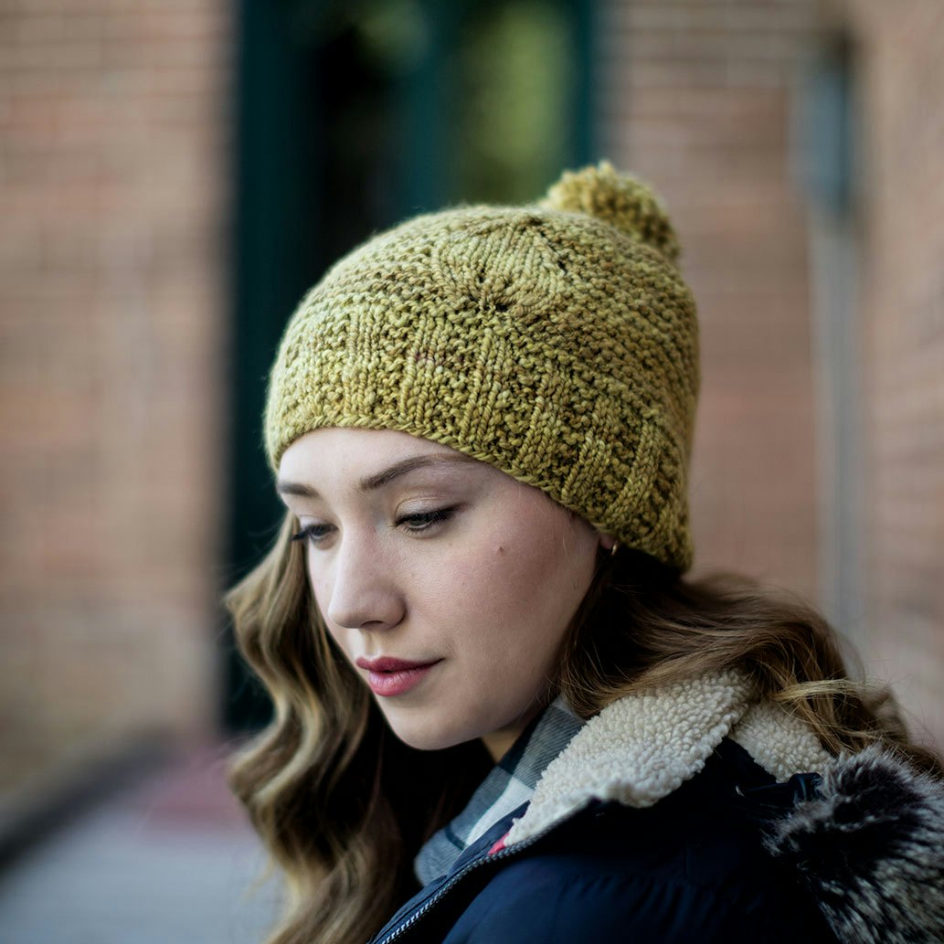 With slanting decreases and carefully placed yarnovers, a sweet leaf sprouts on the edge of a garter-stitch field in this Leaf Cap by Melissa LaBarre. Photo by George Boe