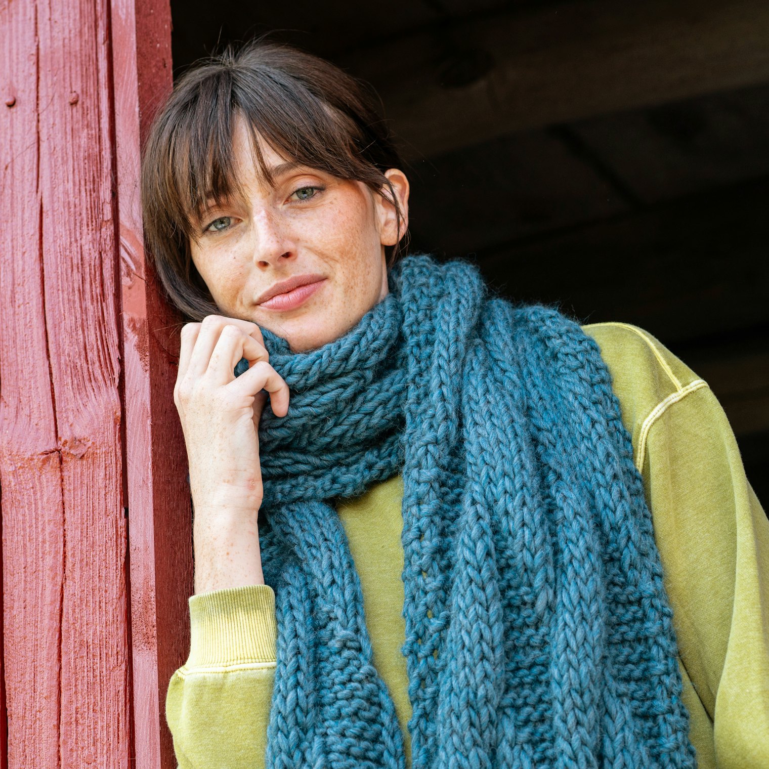 For standout style, consider a contrasting color to wear with an accessory, like the chartreuse top under the Loon Lake Scarf.