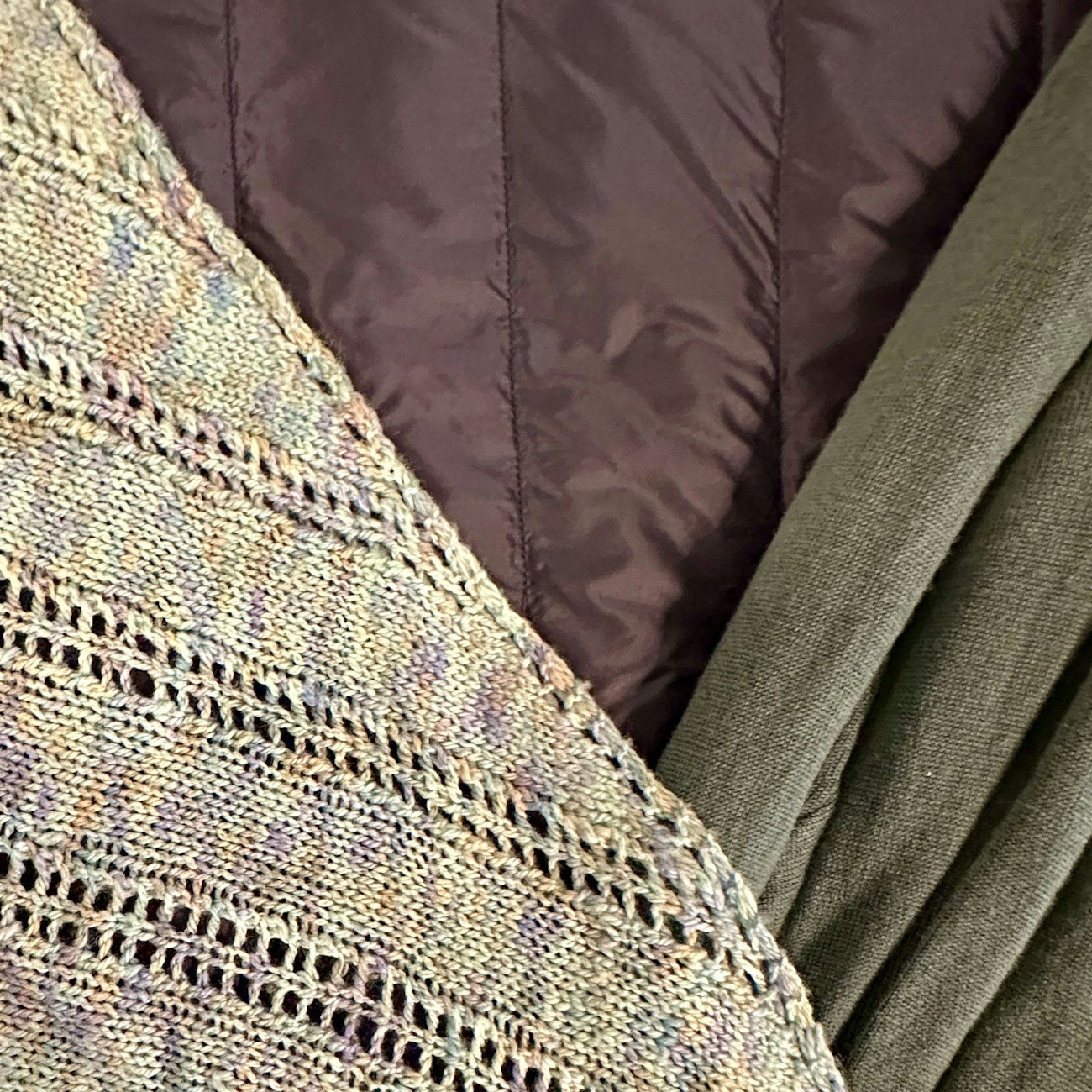variegated shawl, maroon puffer, olive jersey