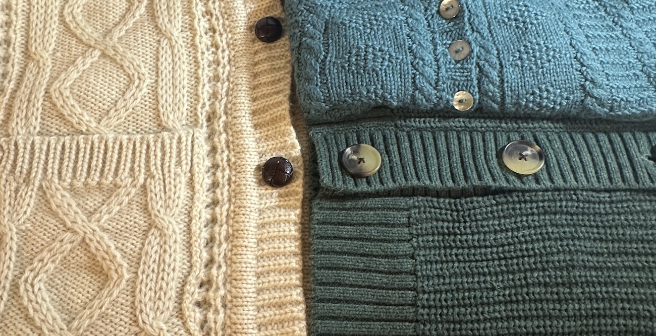 Ivory, teal, and green cardigans with buttons