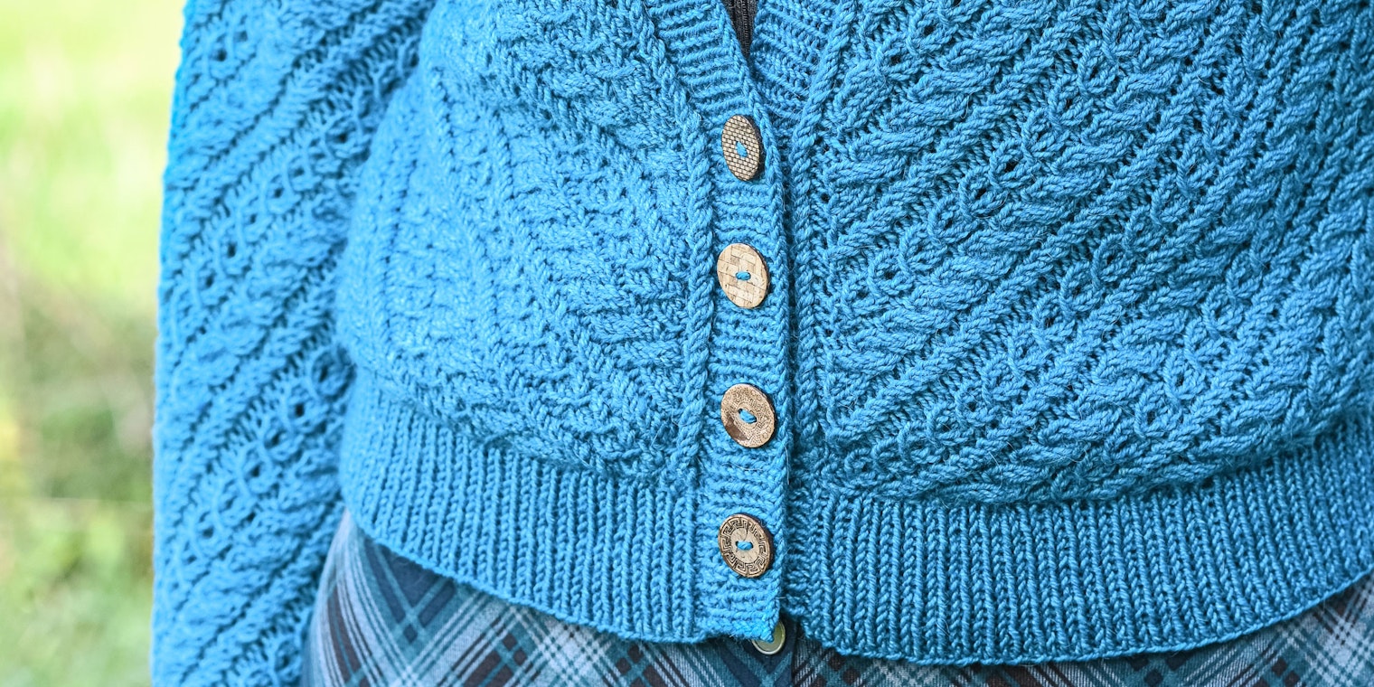 Cabled cardigan with four wooden buttons