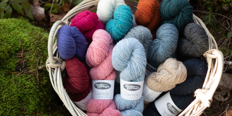 Basket of colorful tweed yarns