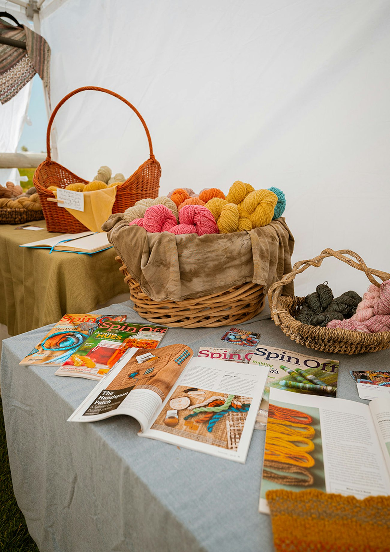 Magazines and yarns spread on table