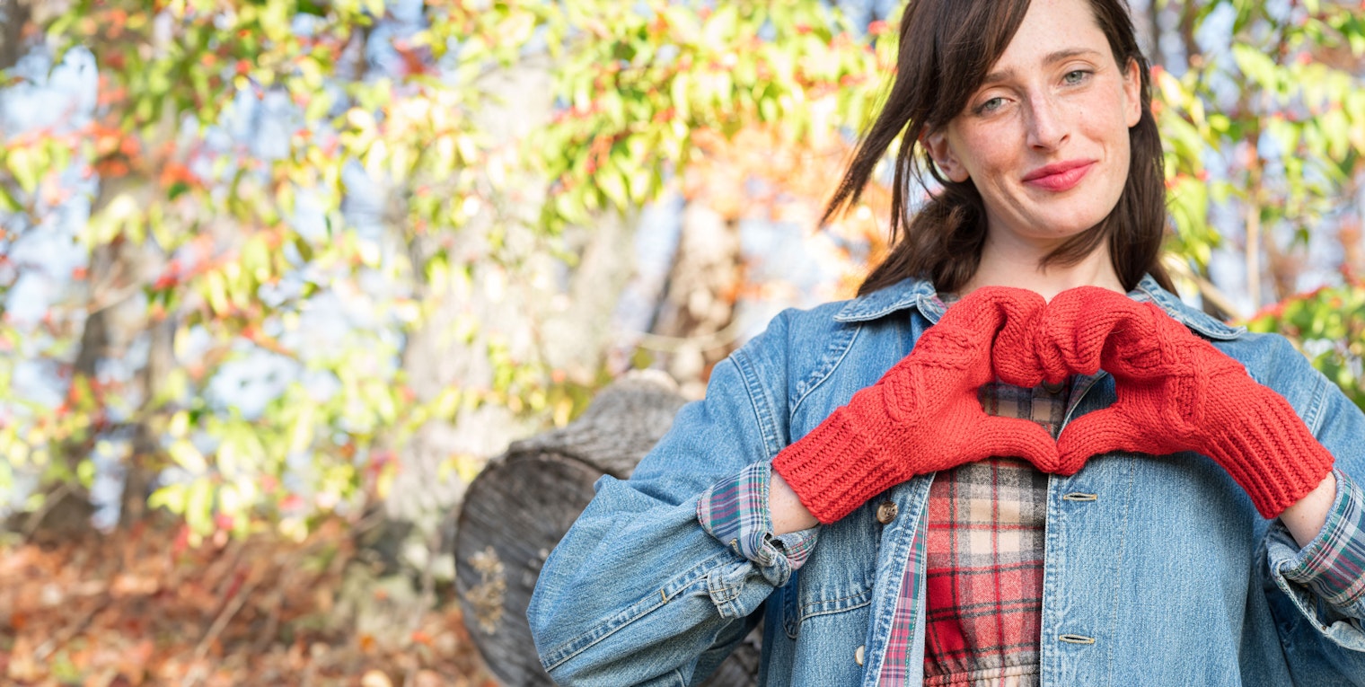 woman wearing red mittens