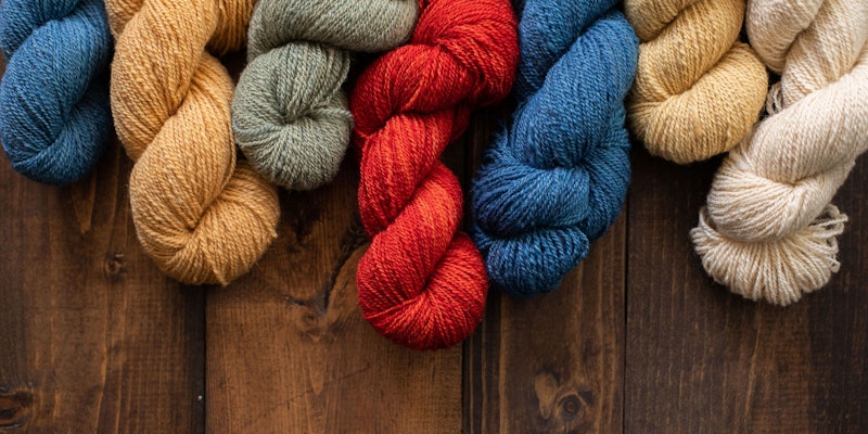Skeins of brightly colored wool yarn