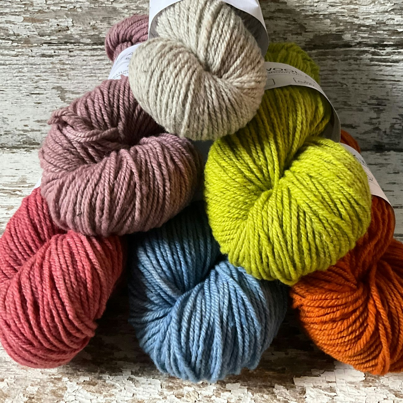 6 skeins of bright yarn arranged in pyramid