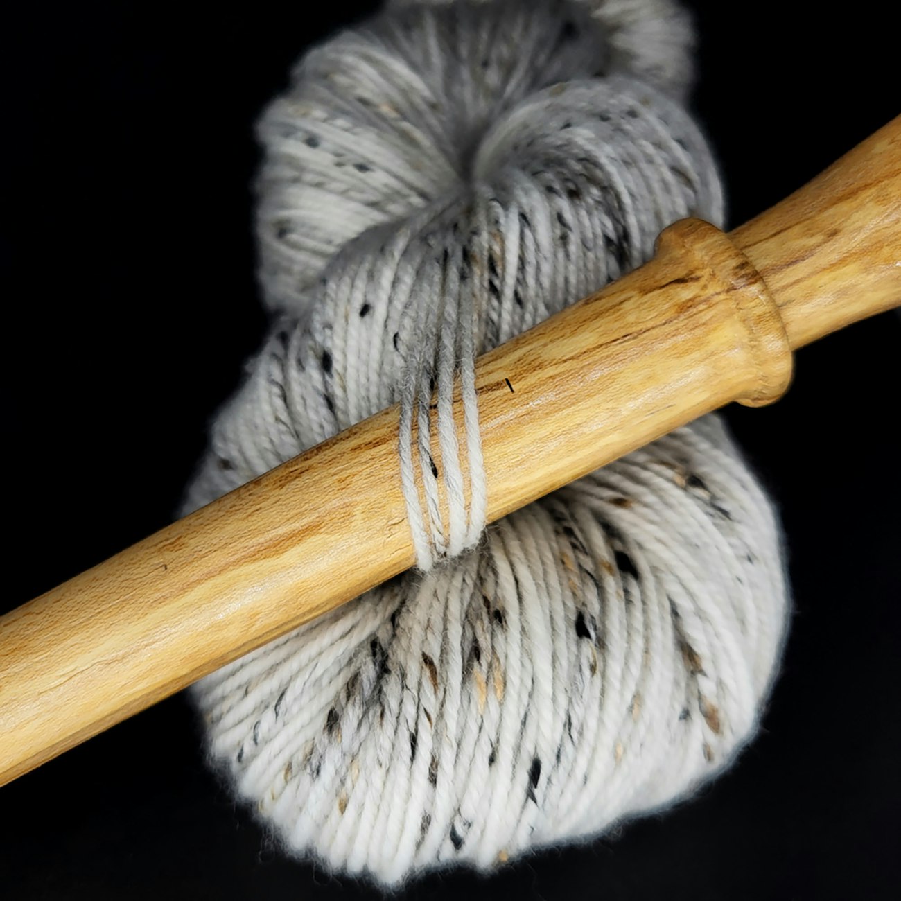 White yarn with brown and black flecks