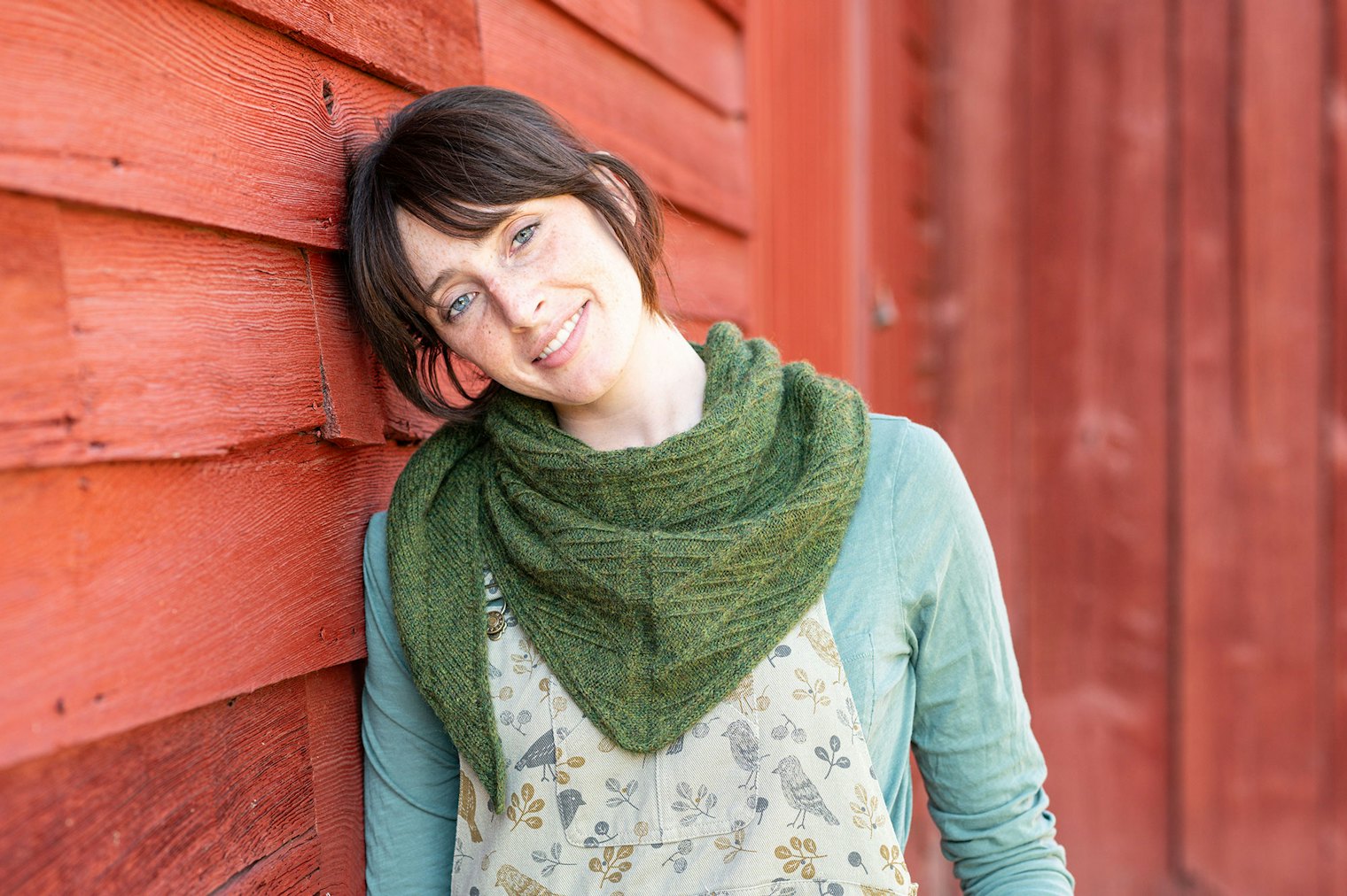 Think outside the box and layer various shades of the same color. The greens in a variety of patterns here allow the Turnout Shawl to stand out.