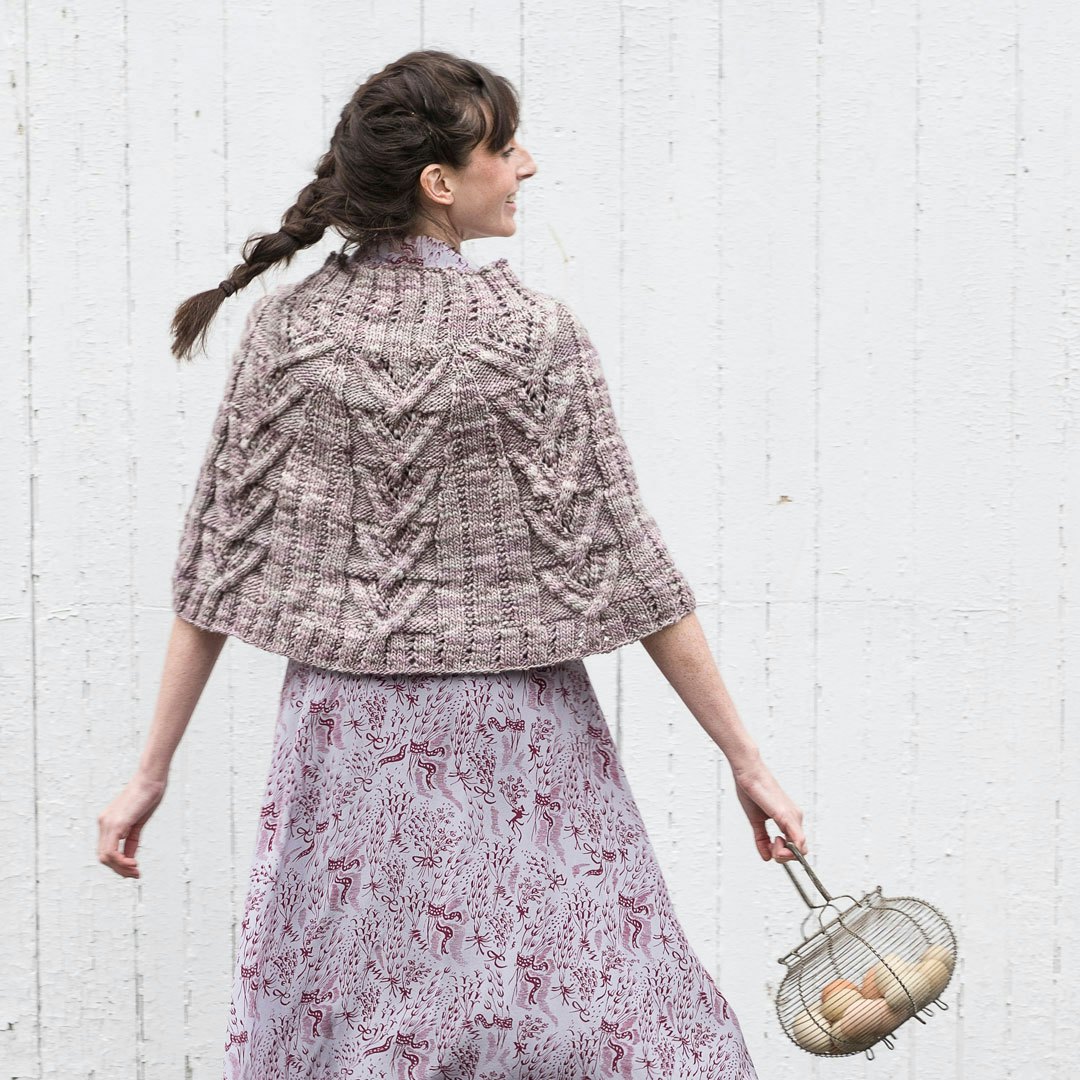 The Chill Chaser Poncho looks dreamy with a vintage silk dress.