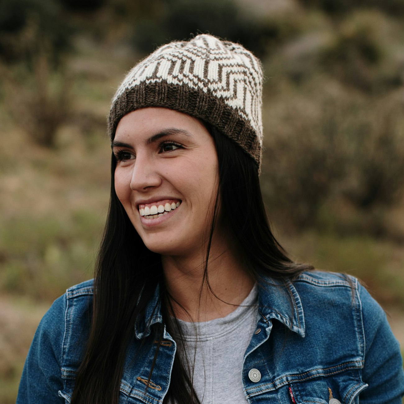 Woman in brown and white hat