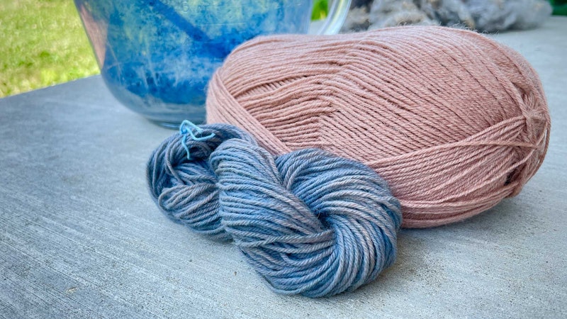 Skeins of blue and tan yarns