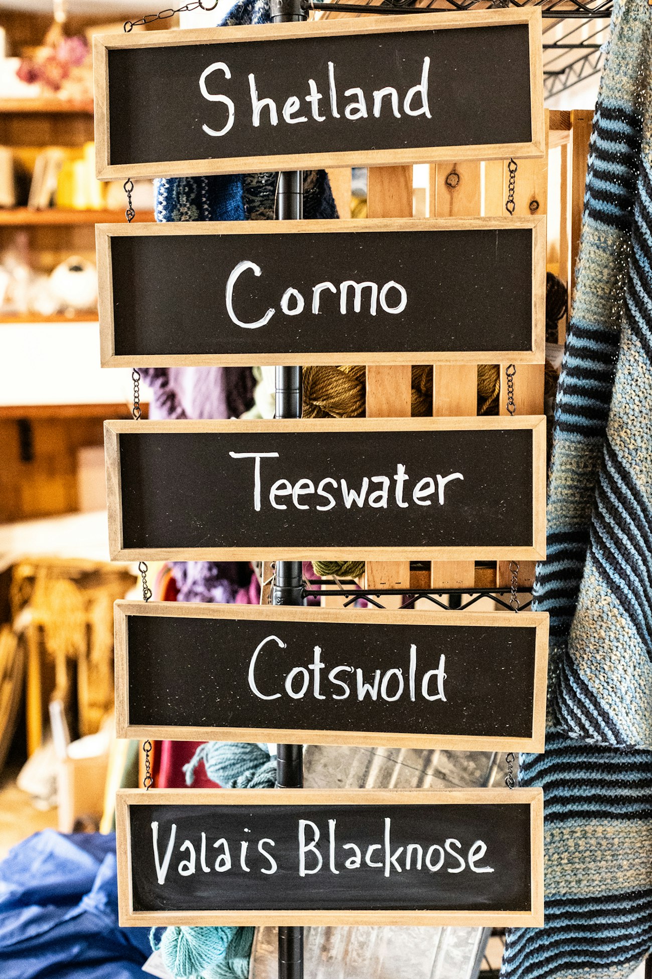 Chalkboard signs hanging in yarn store