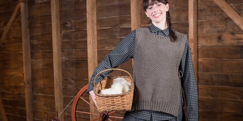 woman wearing a knitted gray vest