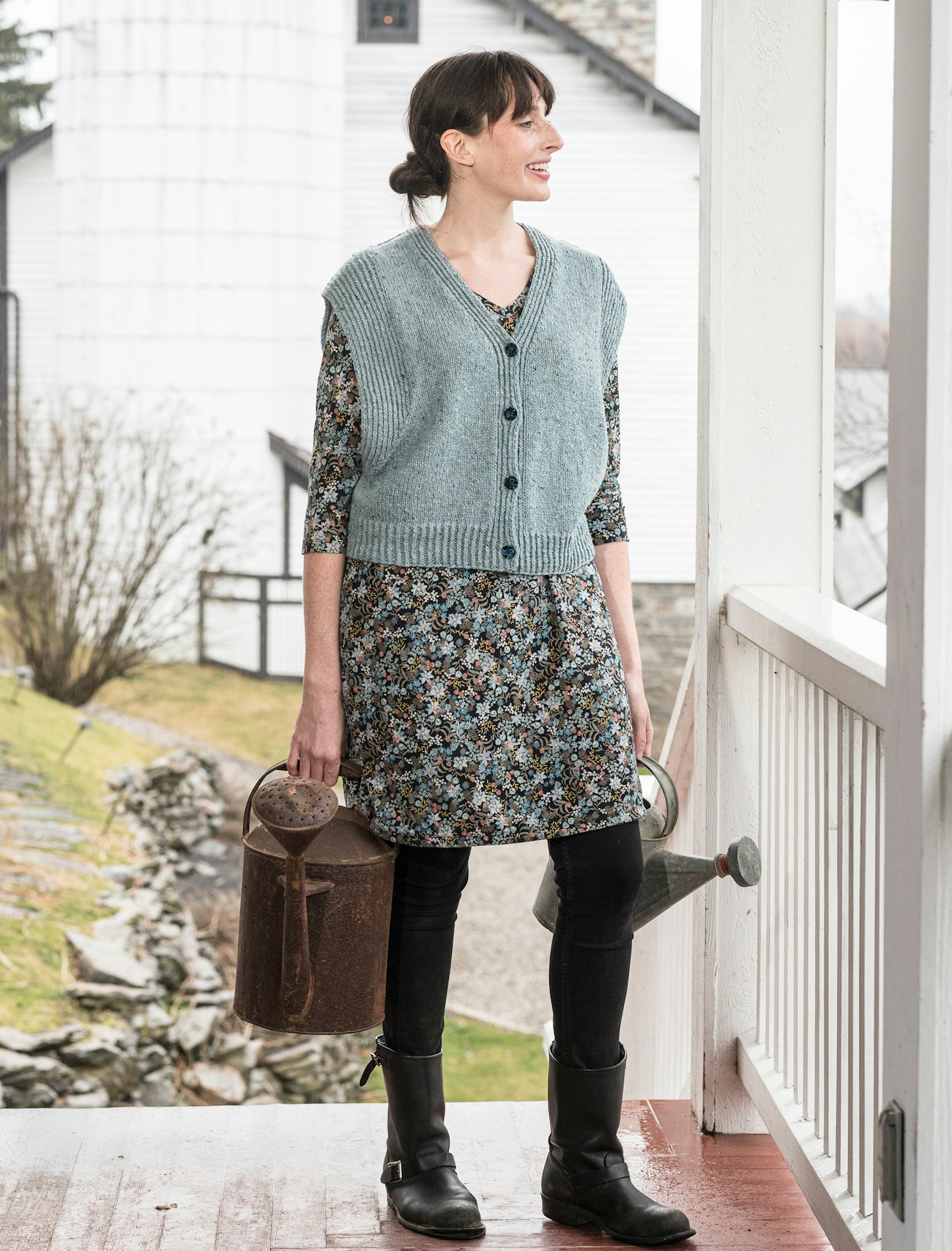 Woman in blue cardigan vest
