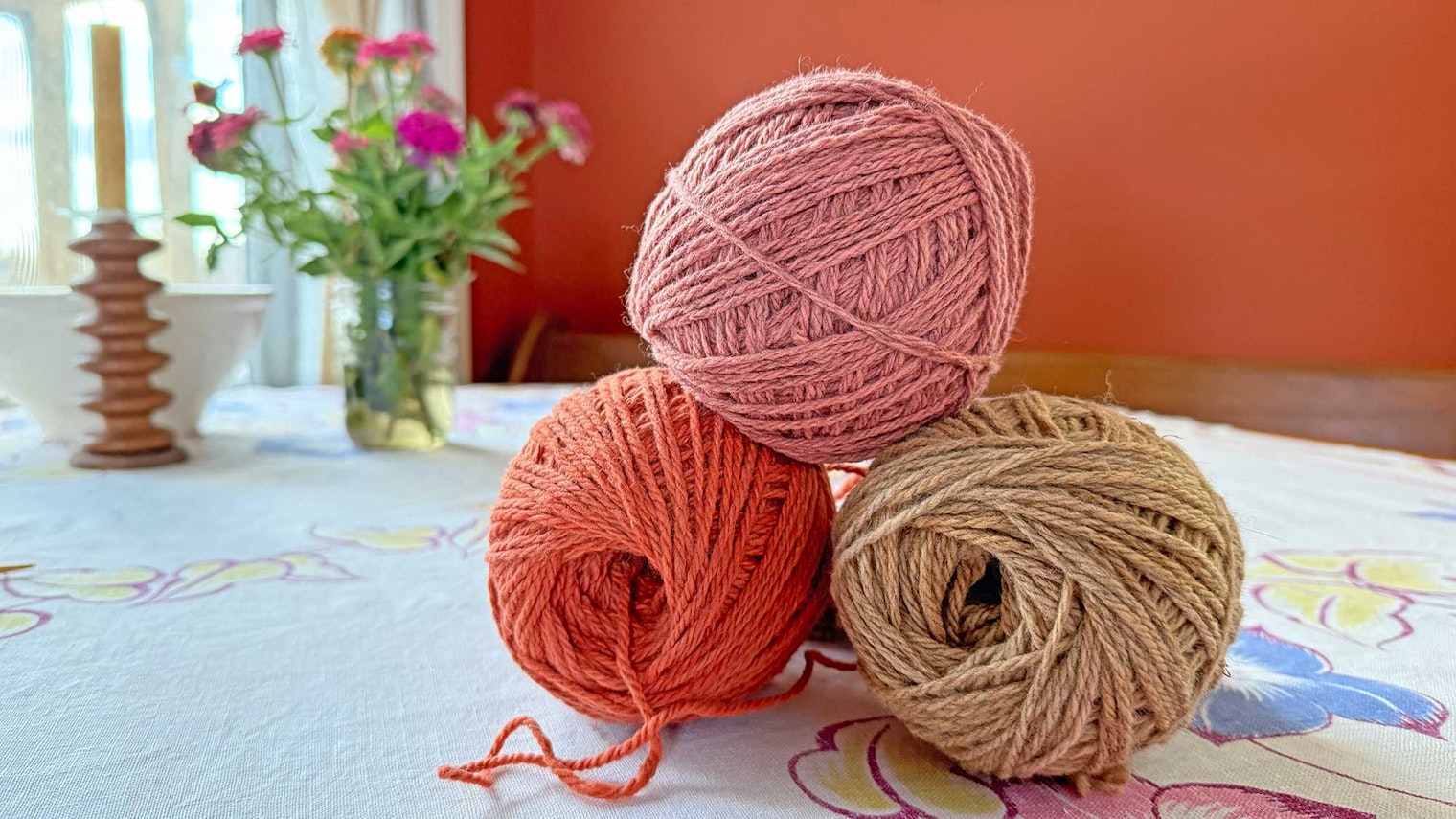 pink and tan balls of yarn
