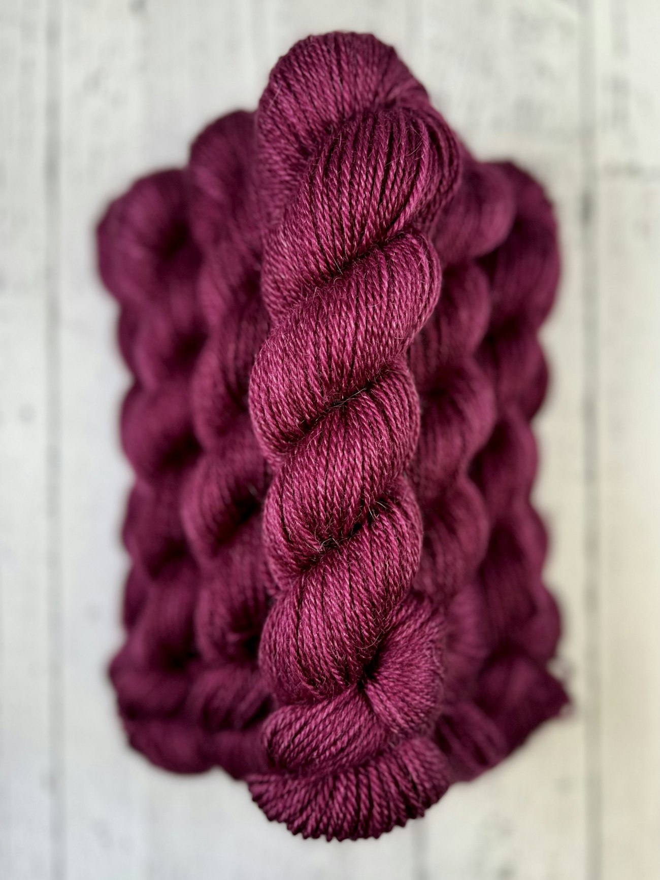 Skeins of wine-red yarn