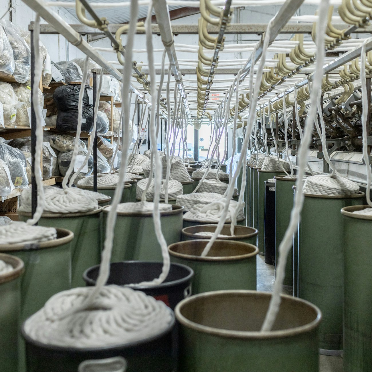 Green bins filled with coils of wool