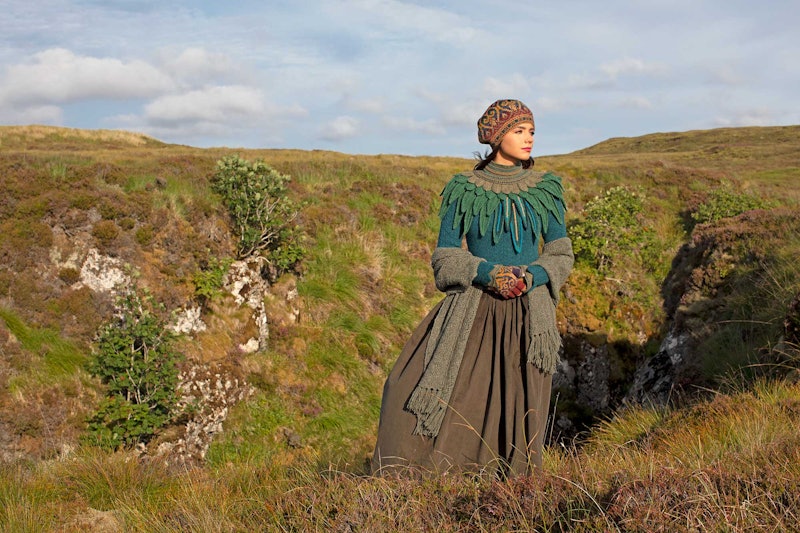 woman wearing green sweater and long skirt