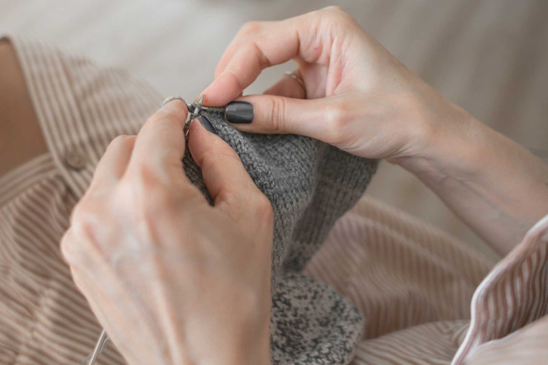 woman's hands knitting