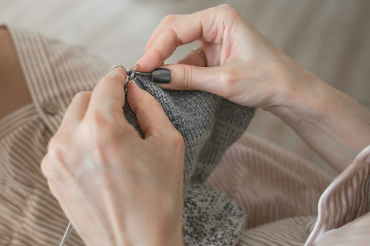 woman's hands knitting