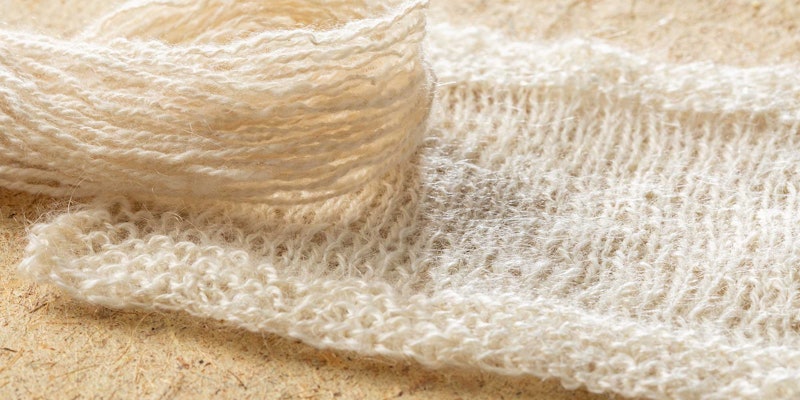 off-white knitted swatch and yarn