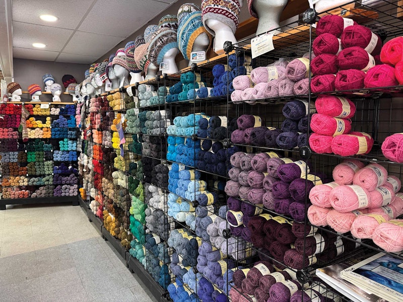 A wall of Shetland yarn in many different colors.