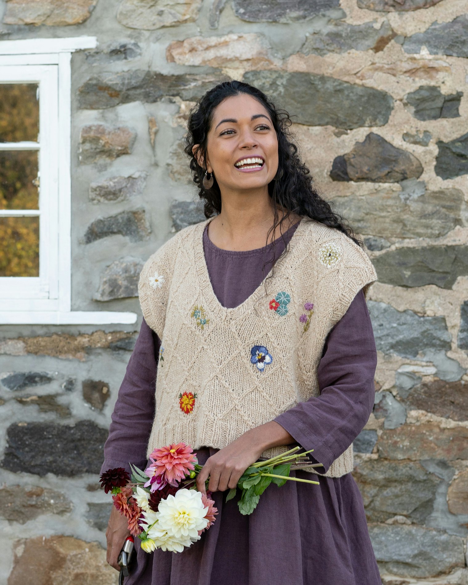 The Luisetta Vest is paired with a simple linen dress to allow the embroidered details to shine.