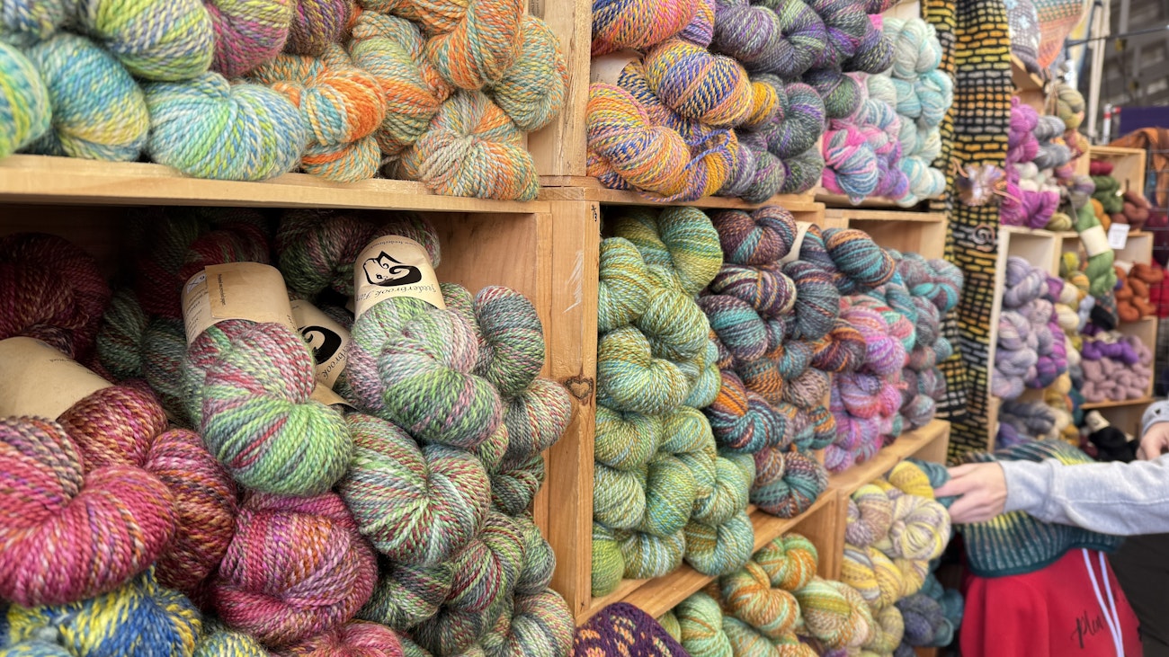 Wall of brightly colored yarn