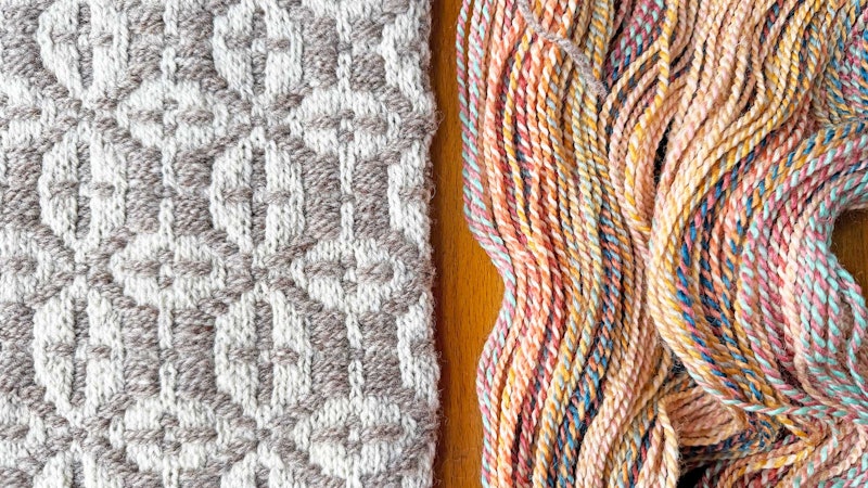 knitted tan and white swatch plus multi-colored skein of yarn