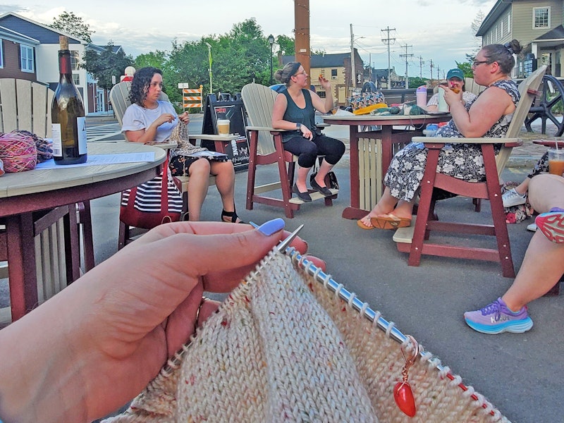 women knitting in the outdoors
