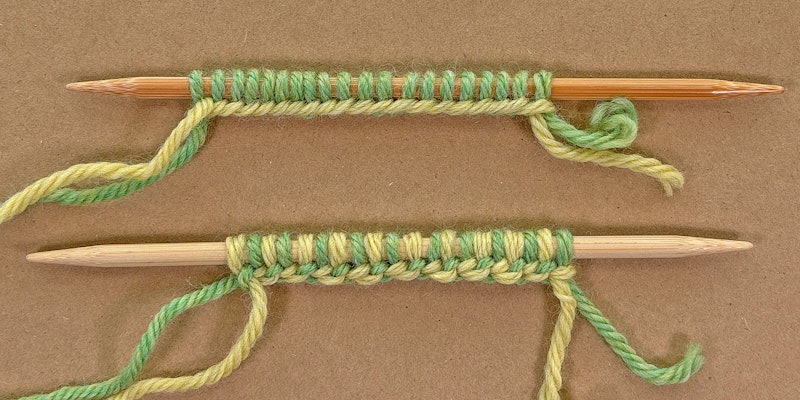 knitting needles with green and yellow yarns