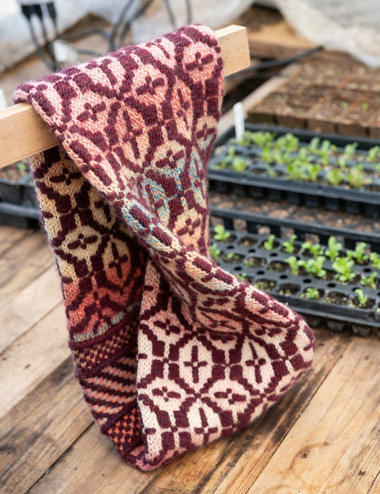 The Clover Ridge Cowl uses a knitted inlay technique to create a woven effect.