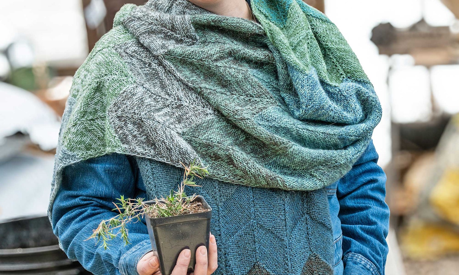 woman wearing blue, gray, and green knitted shawl