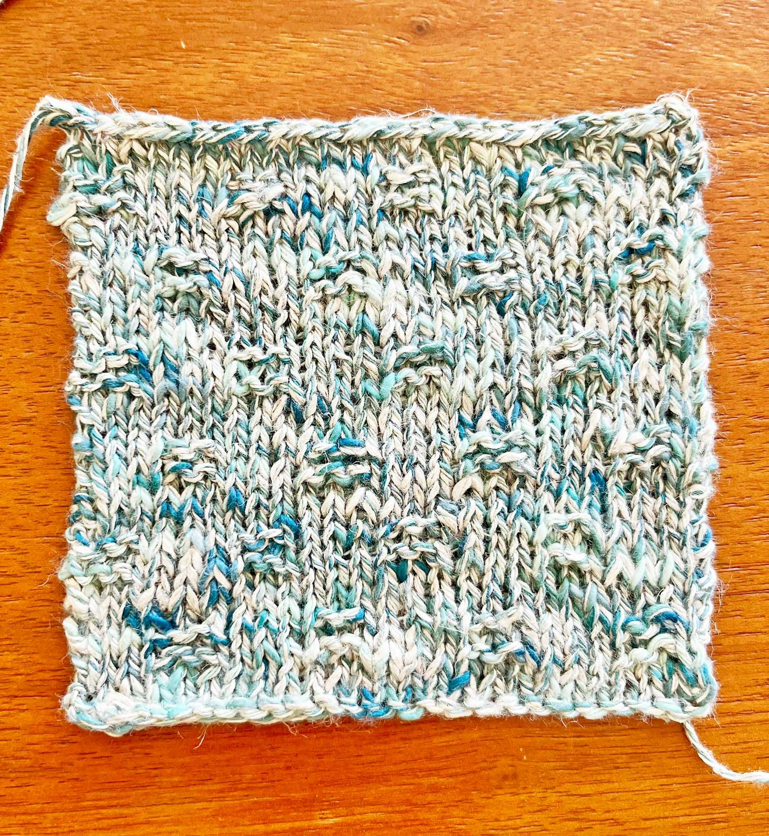 Lindsay likes how the small garter-stitch squares add some texture to the overall pattern.