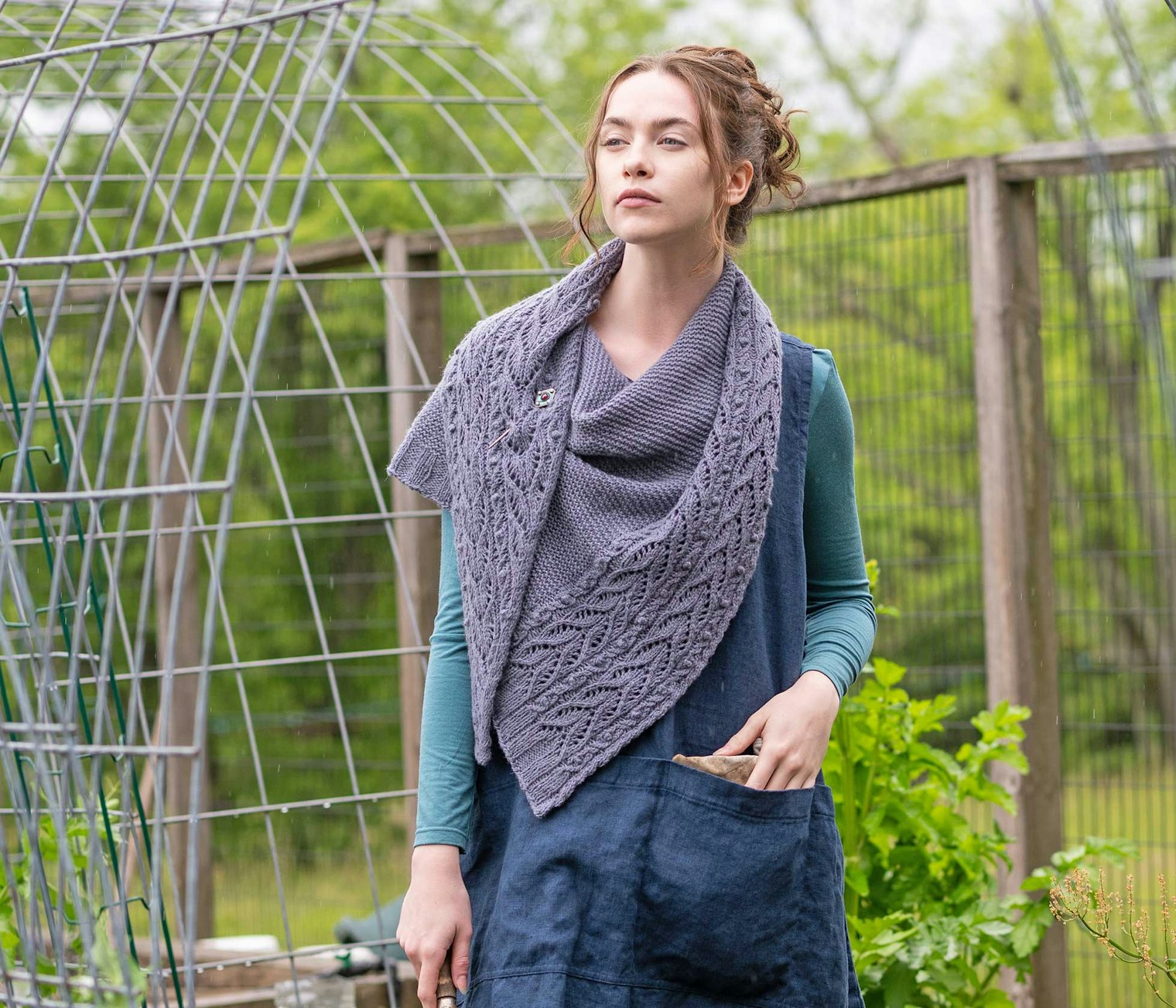 The Gelso Shawl is paired with a linen apron for a casual look.