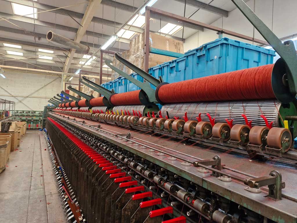 On the spinning frame, the different colors have blended into a gentle heather.