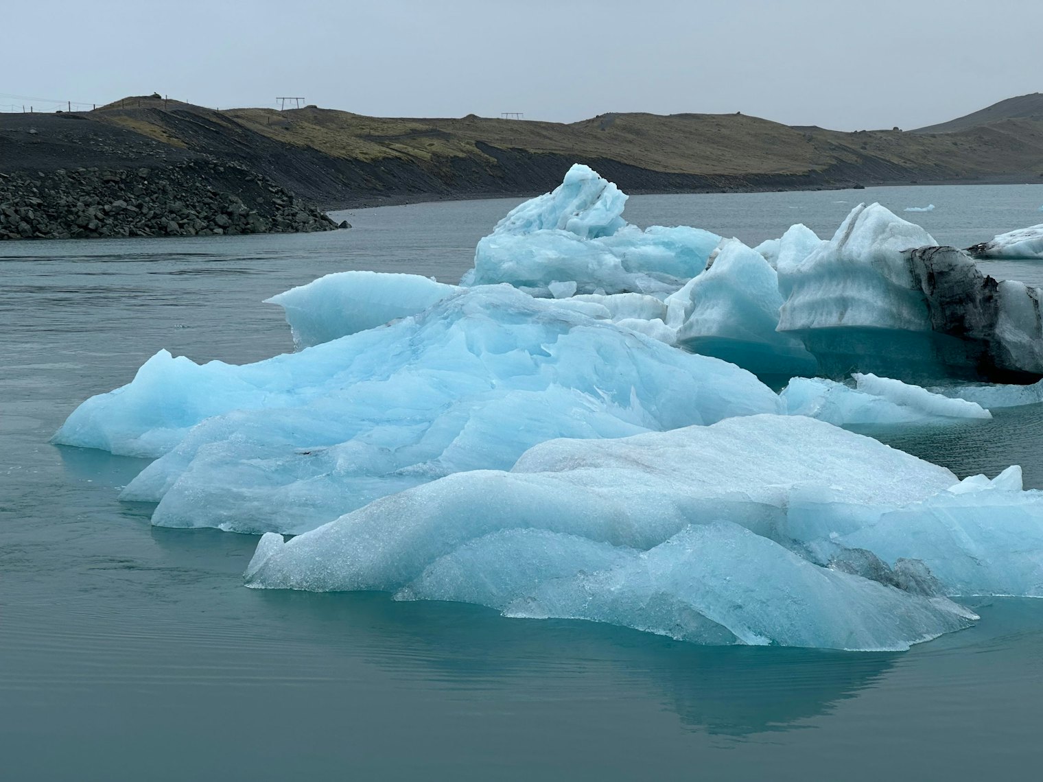 Blue icebergs float in the Jökulsárlón Glacier Lagoon, a reminder of the constantly changing landscape.