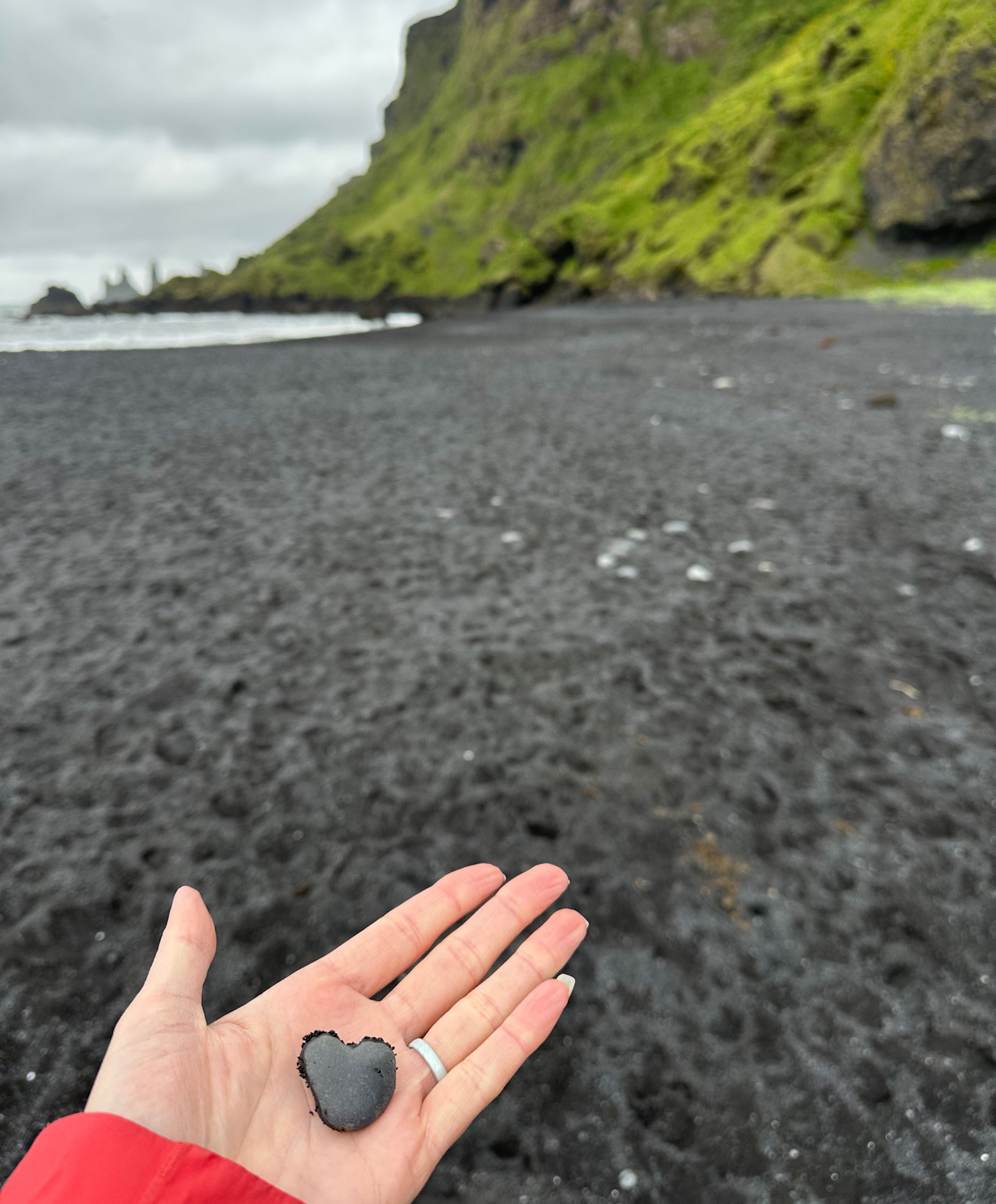 From fire and water, we get the Vikurfjara Black Sand Beach, which gets its distinctive sand color from basalt broken down by the sea into fine sand and rocks, like the heart-shaped one I am holding.