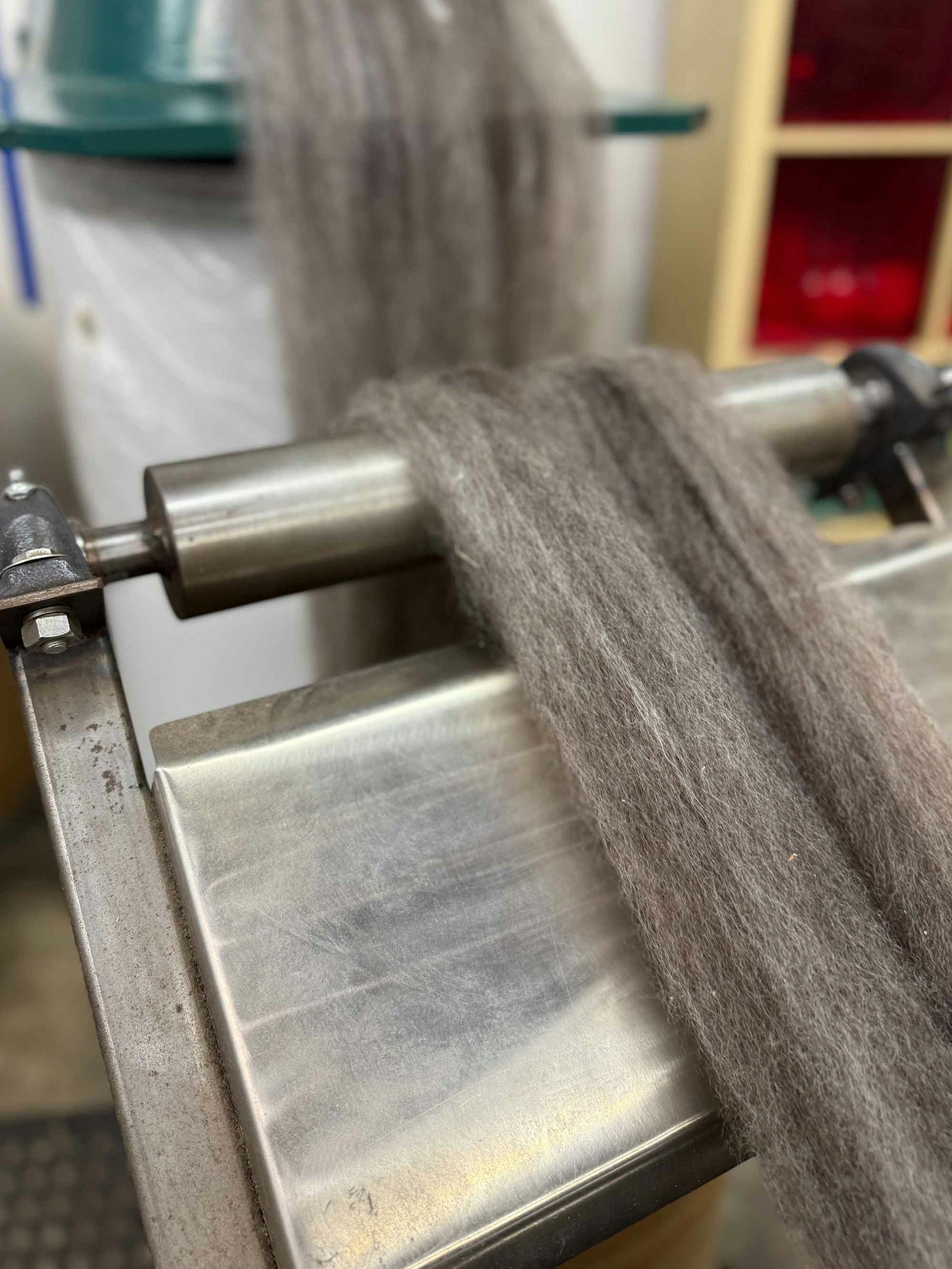 The fiber has been carded into roving and is ready for the pindrafter.