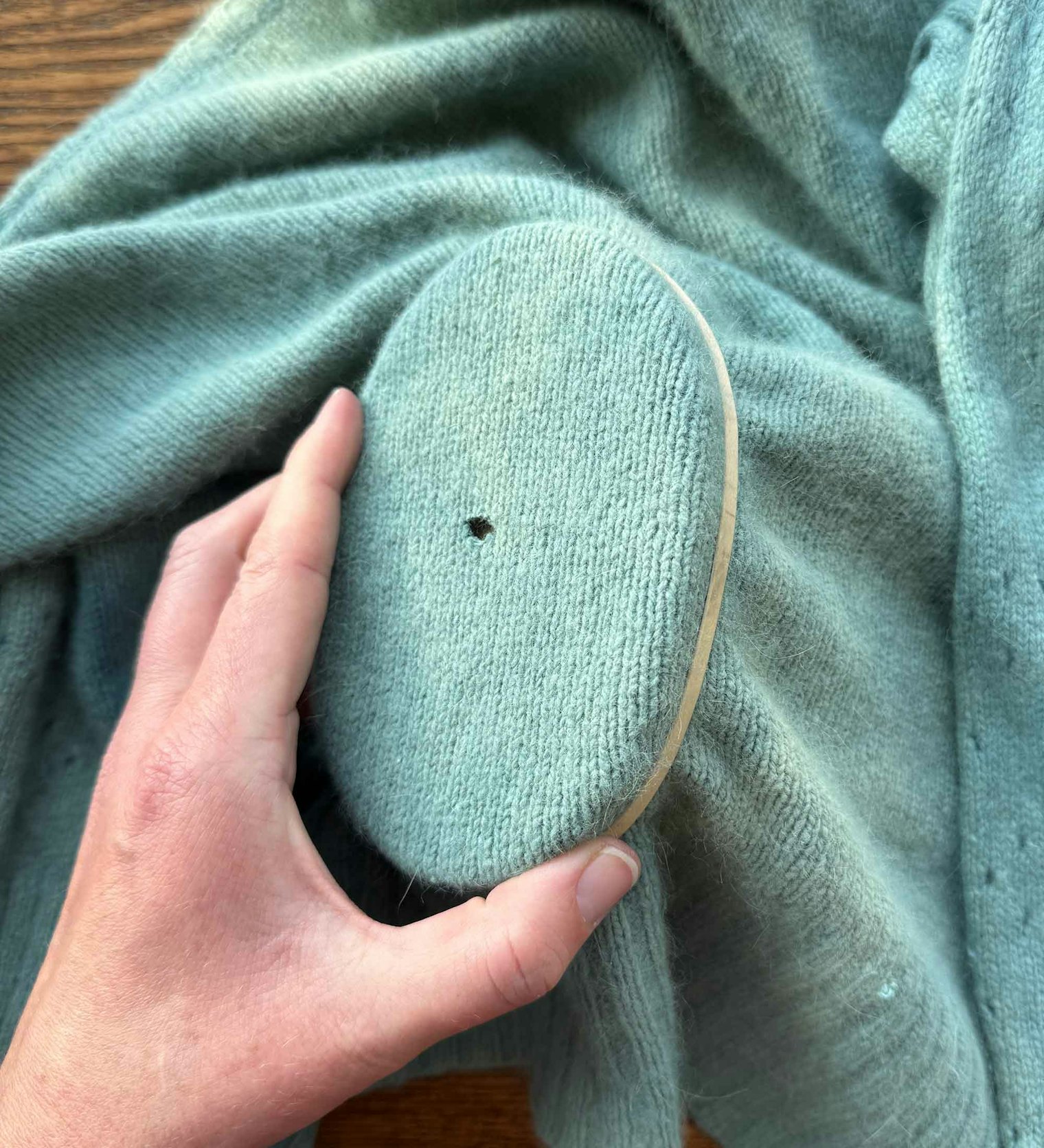 Simply place your fabric over the box and use a ribbon or rubber band to secure. Placing a scrap of white paper under the hole can help make the edges more visible.